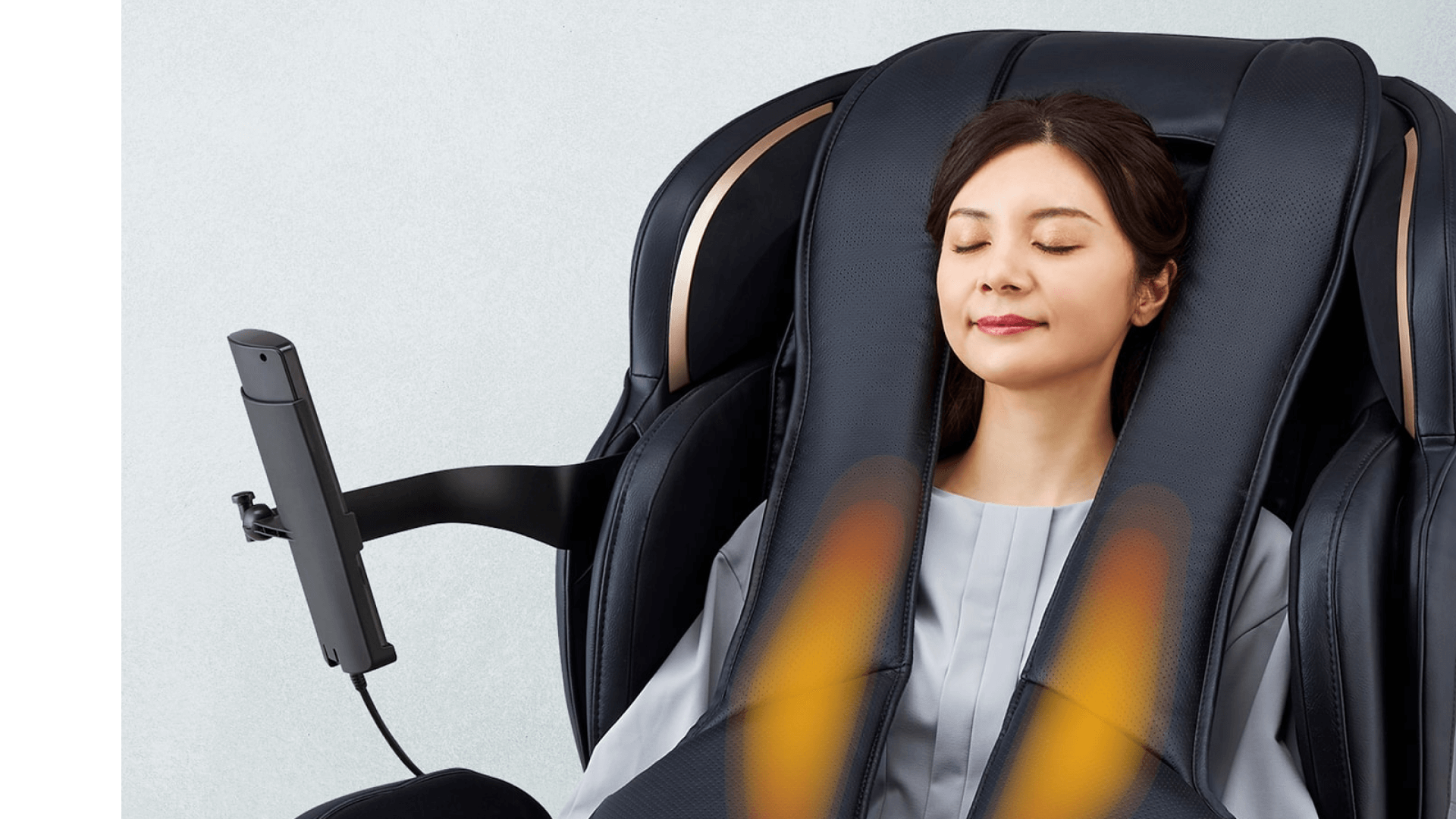 Woman relaxes in massage chair with heating elements highlighted