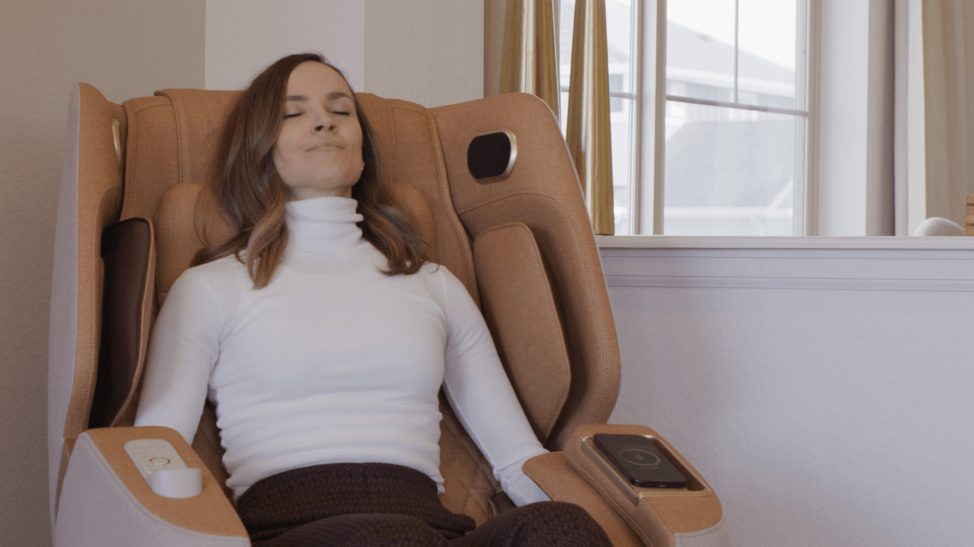 Woman relaxes in massage chair at home
