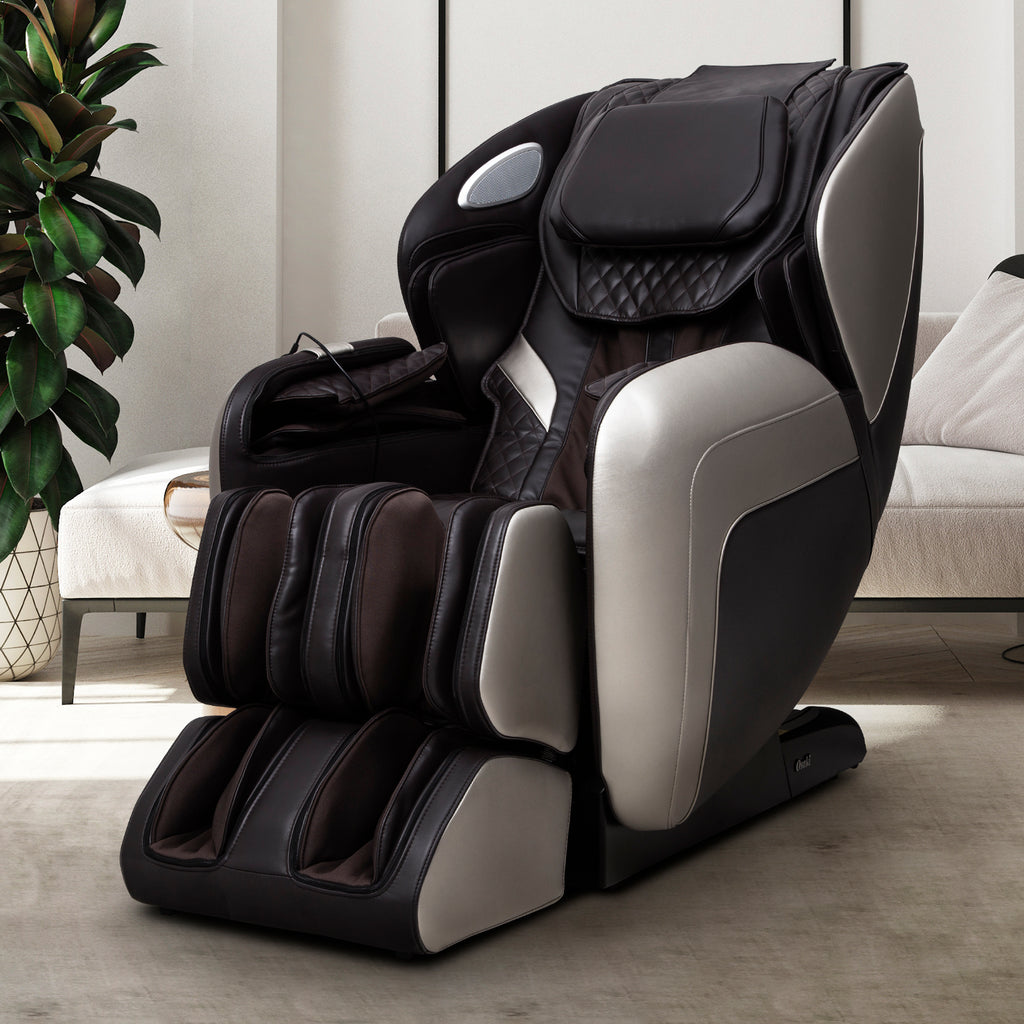 Brown OS-Atai massage chair in a room with a plant and sofa
