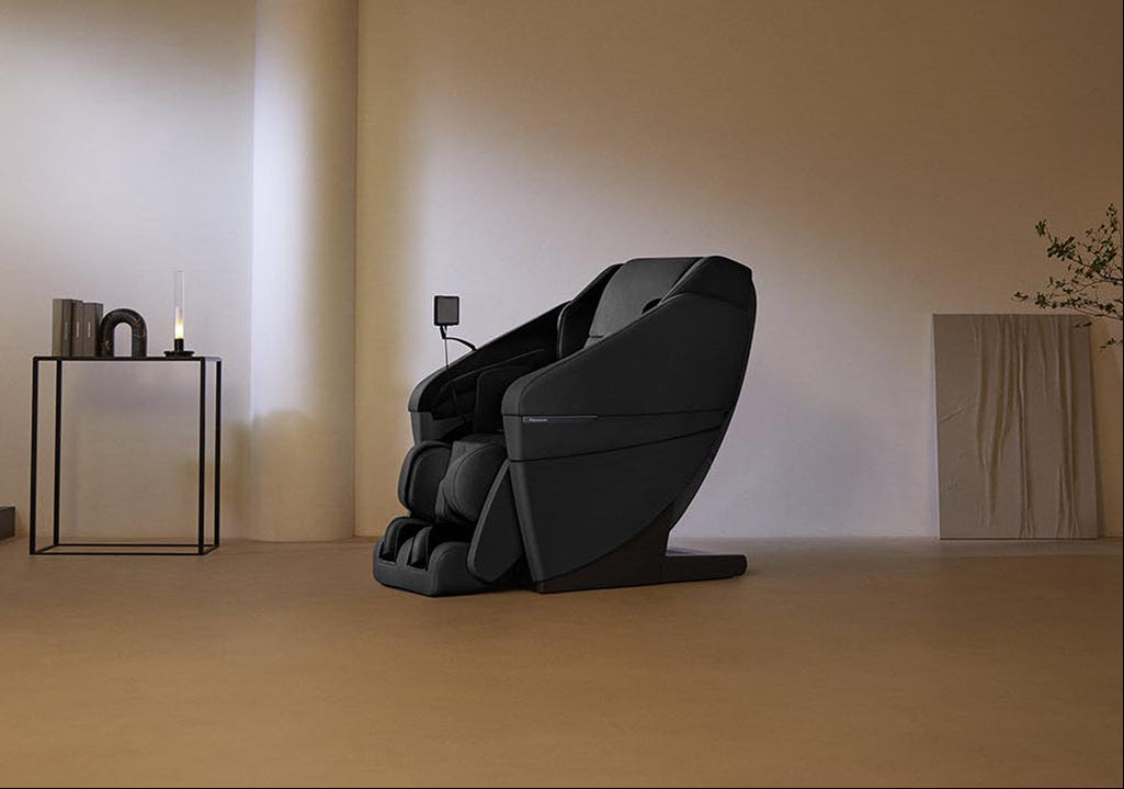 Panasonic MAN1 Massage Chair in a minimalistic room with a lamp and small table