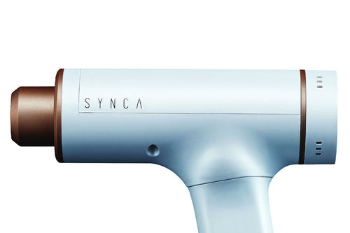 Close-up of Synca Kitta Performance Percussive Sports Therapy Massager viewed from the side on a white background