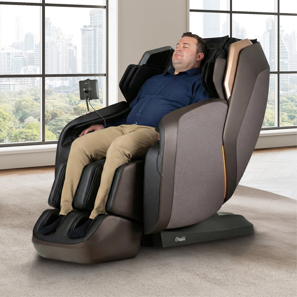 Man relaxing in a Osaki Duke XL 4D Massage Chair with a cityscape view through large windows